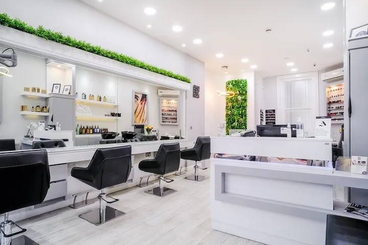Reception desk and styling chairs at London Beauty House in Hammersmith.